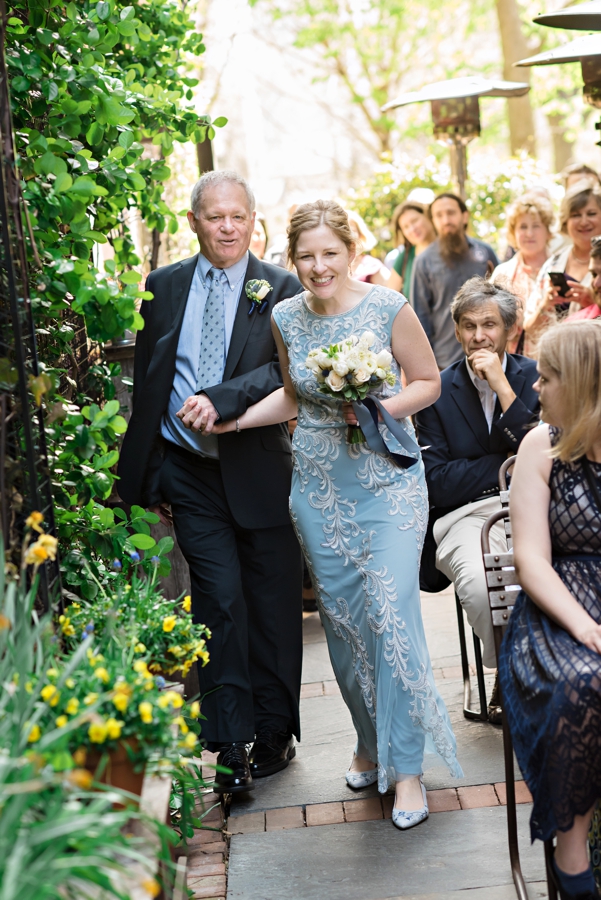 A bride and her father walk down the isle at her Talula's Garden Wedding.